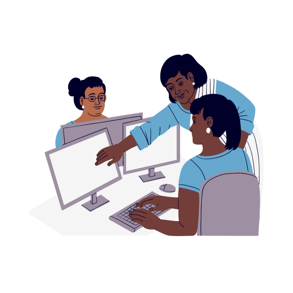 Three women work on research together at computers. Two women look at one desktop computer screen while the 3rd is typing on another monitor.